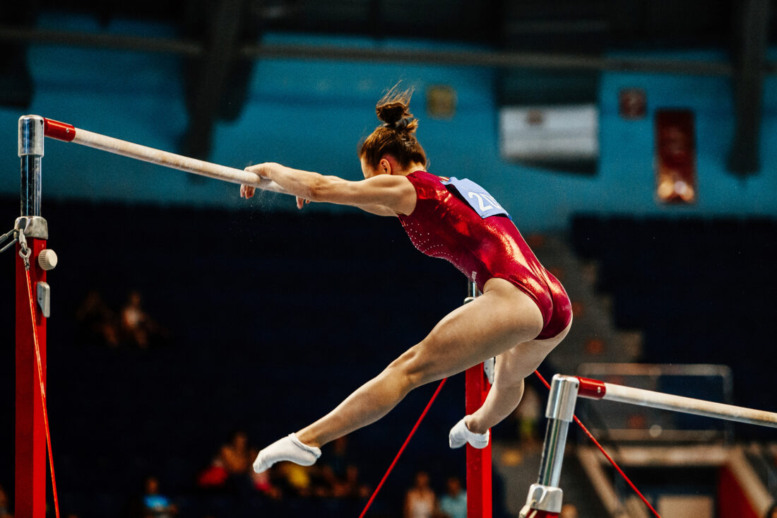 Gymnast on uneven bars